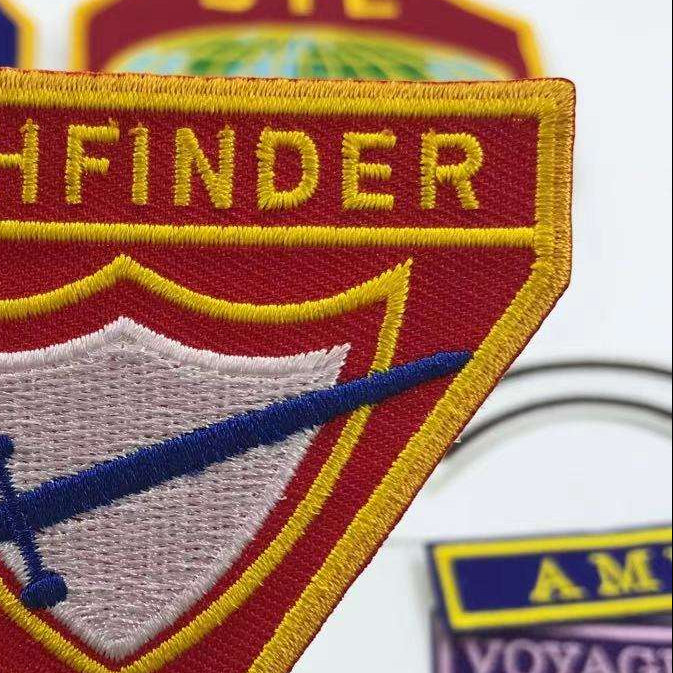 Close-up of an embroidered patch with an embroidered border